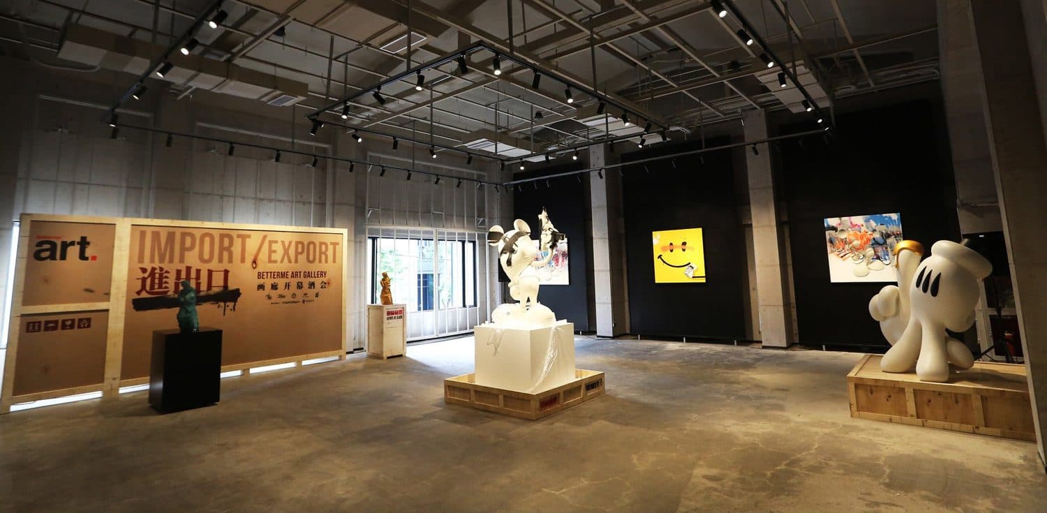 Sculptures and paintings staged around the Import / Export banner