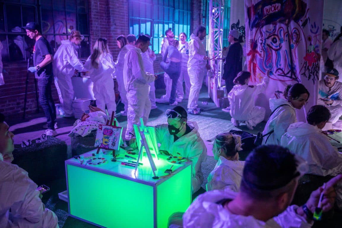 The NFT LA 'Underground Art Rave', canvases hung from concert trussing.
