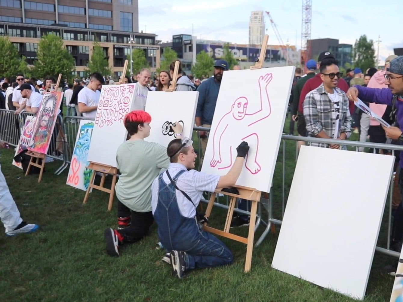 The outdoor VeeCon edition on Opening Night, guests painting canvases on easels.