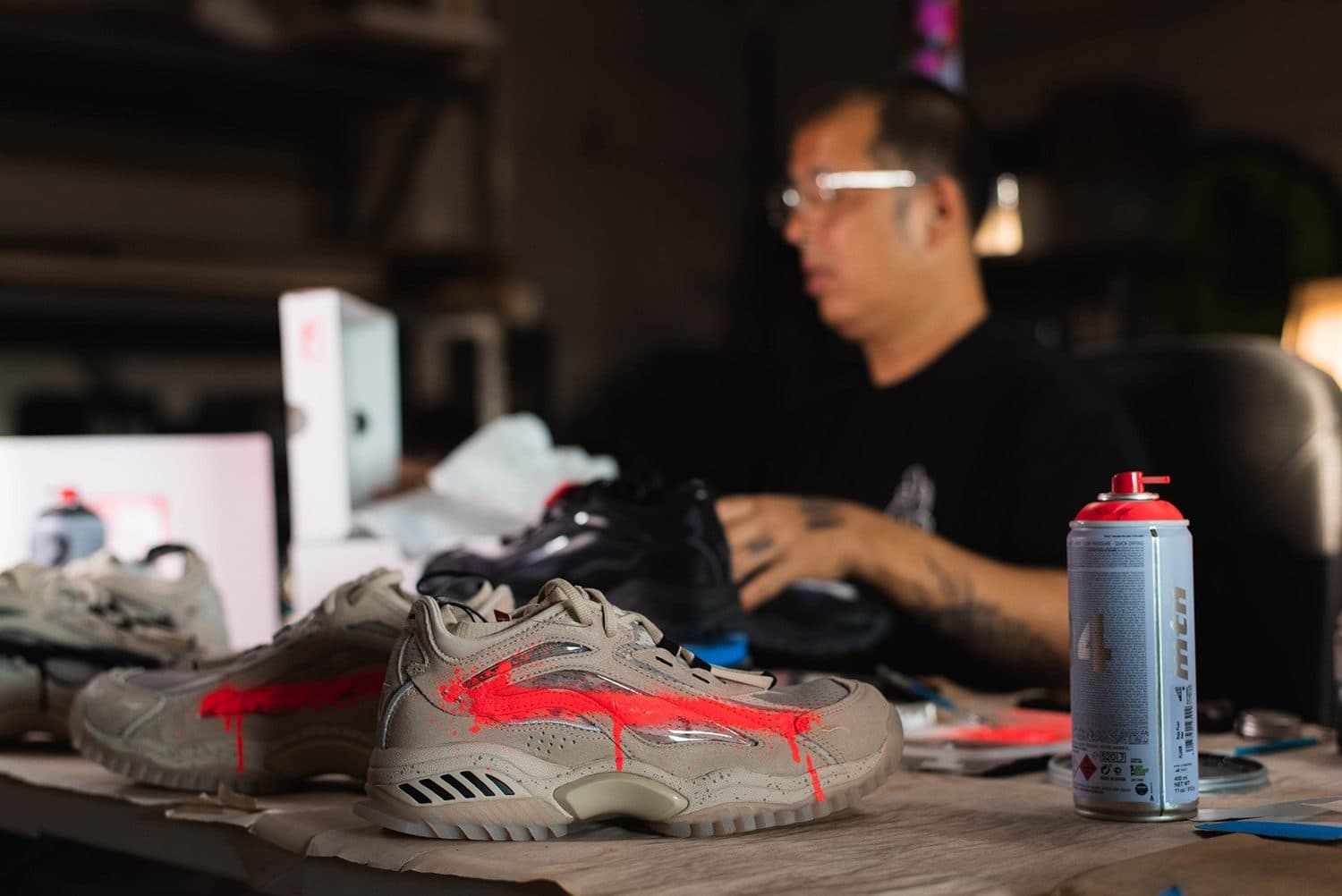 OG Slick customizing a Li-Ning sneaker in the studio.